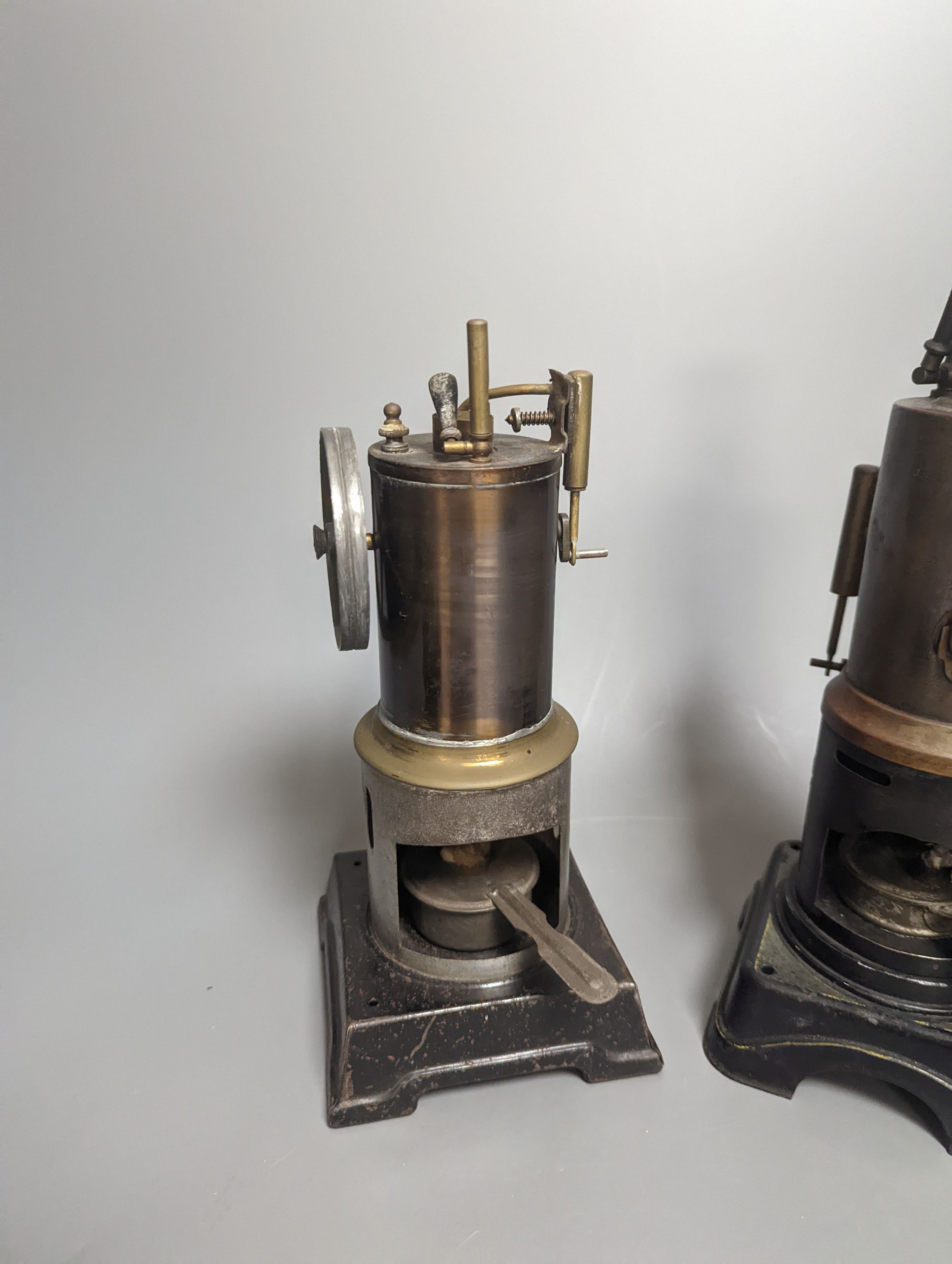 A Bing tinplate model boiler, 28.5 cm high and two other tinplate model boilers
